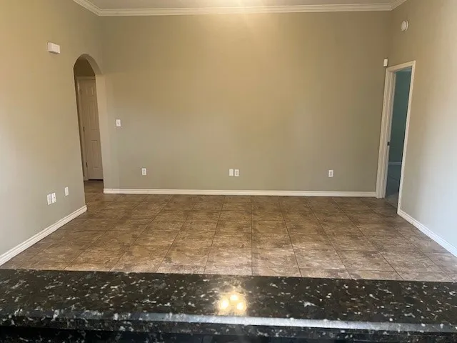 a view of a hallway with a wooden door