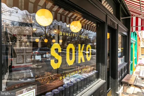 a bathroom with a sink mirror and vanity