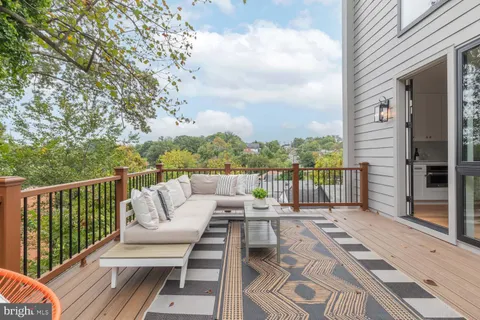 a balcony with wooden floor