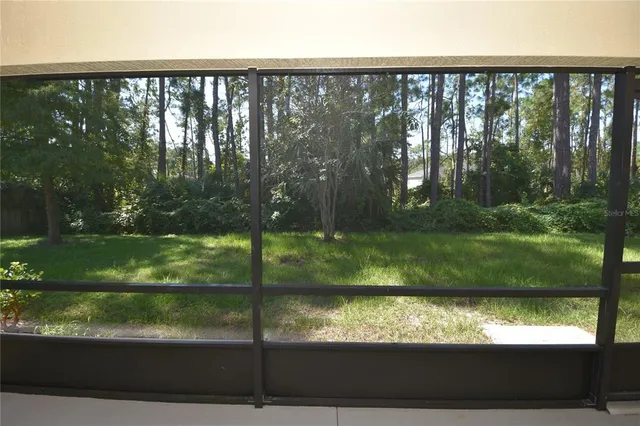 a open kitchen with a refrigerator and a sink