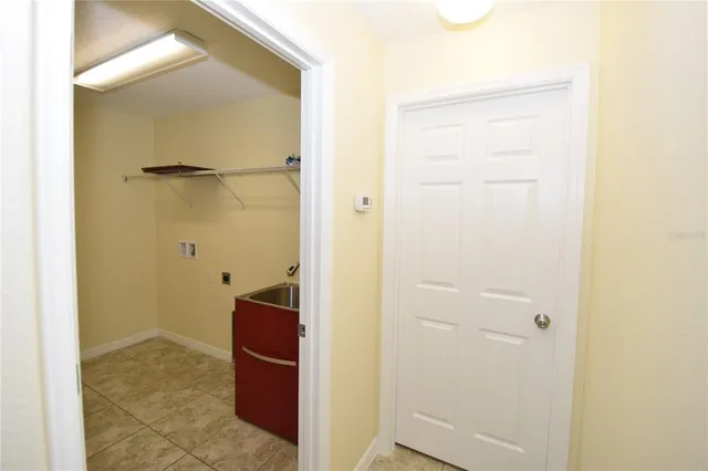 a view of a bathroom with a sink and a mirror