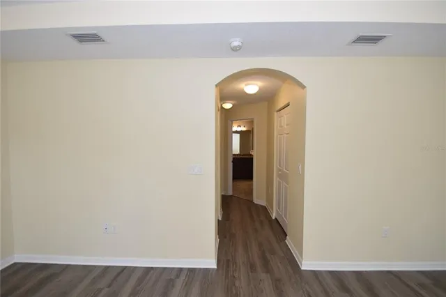 a bathroom with a granite countertop sink a mirror and a bathtub