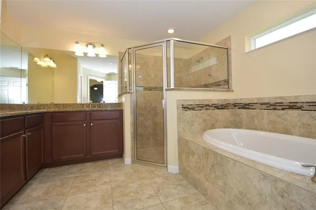 a bathroom with a granite countertop sink mirror and