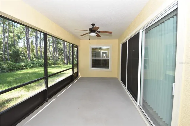 a large kitchen with kitchen island a counter top space a sink stainless steel appliances and cabinets