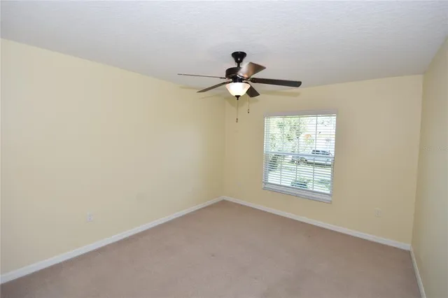 a view of a big room with carpet