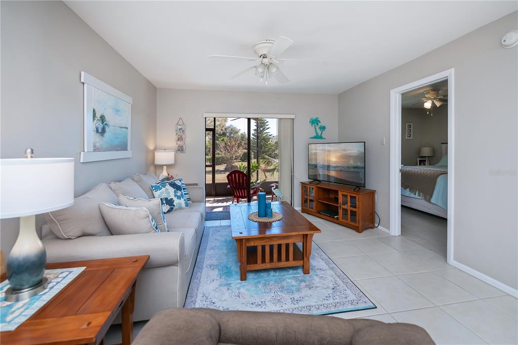 25275 Rampart Boulevard, Unit 1802 Punta Gorda, FL 33983 - Photo 19 of 41 a living room with furniture and a flat screen tv