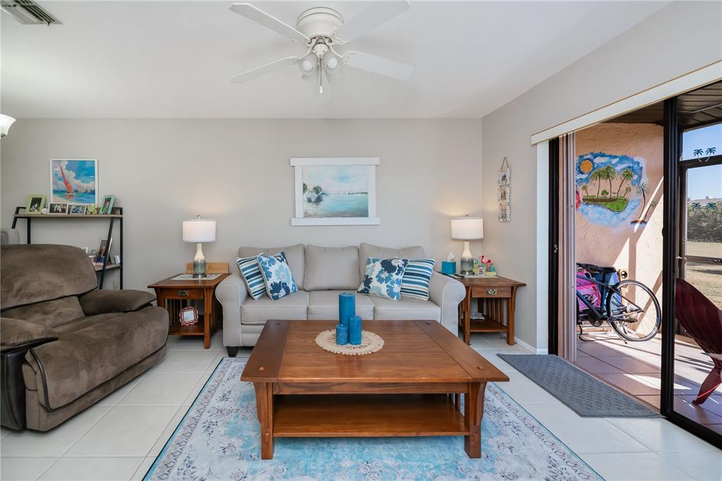 25275 Rampart Boulevard, Unit 1802 Punta Gorda, FL 33983 - Photo 20 of 41 a living room with furniture and a flat screen tv
