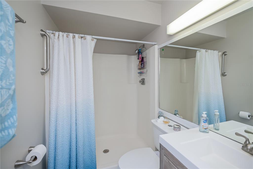 25275 Rampart Boulevard, Unit 1802 Punta Gorda, FL 33983 - Photo 25 of 41 a bathroom with a sink toilet and shower