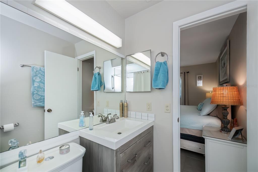 25275 Rampart Boulevard, Unit 1802 Punta Gorda, FL 33983 - Photo 26 of 41 a en suite bathroom with a sink and a mirror