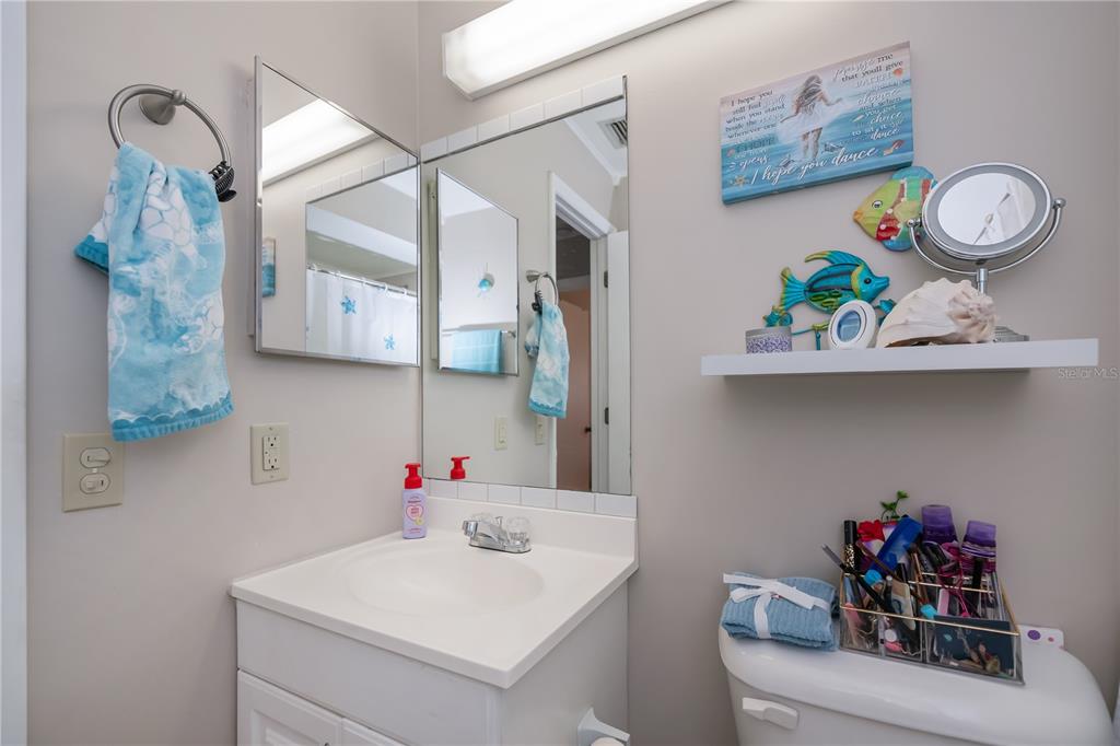25275 Rampart Boulevard, Unit 1802 Punta Gorda, FL 33983 - Photo 28 of 41 a bathroom with a sink a vanity and a mirror