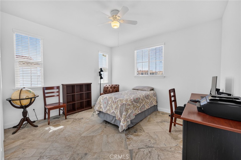 31749 Country View Road Temecula, CA 92591 - Photo 29 of 68 a bedroom with a bed and a chandelier