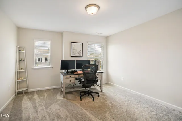 a workspace with furniture and window