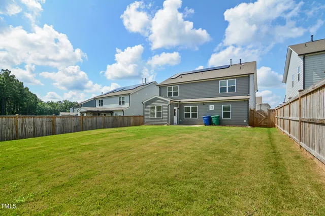 a front view of house with yard and seating