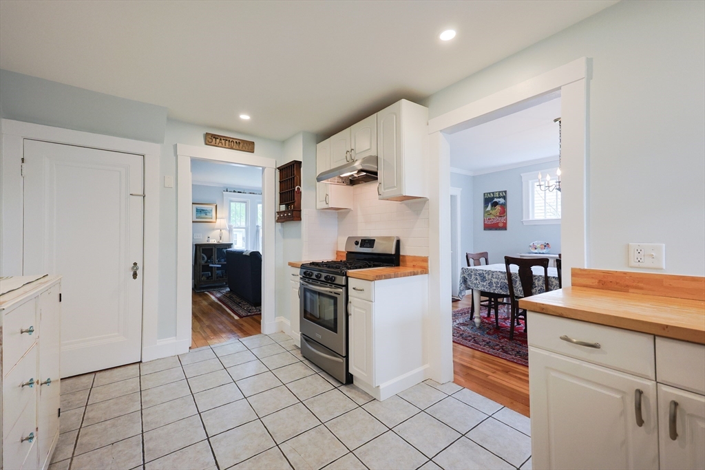 14 Merrill Road Marblehead, MA 01945 - Photo 11 of 29 a kitchen with granite countertop a sink and a stove top oven