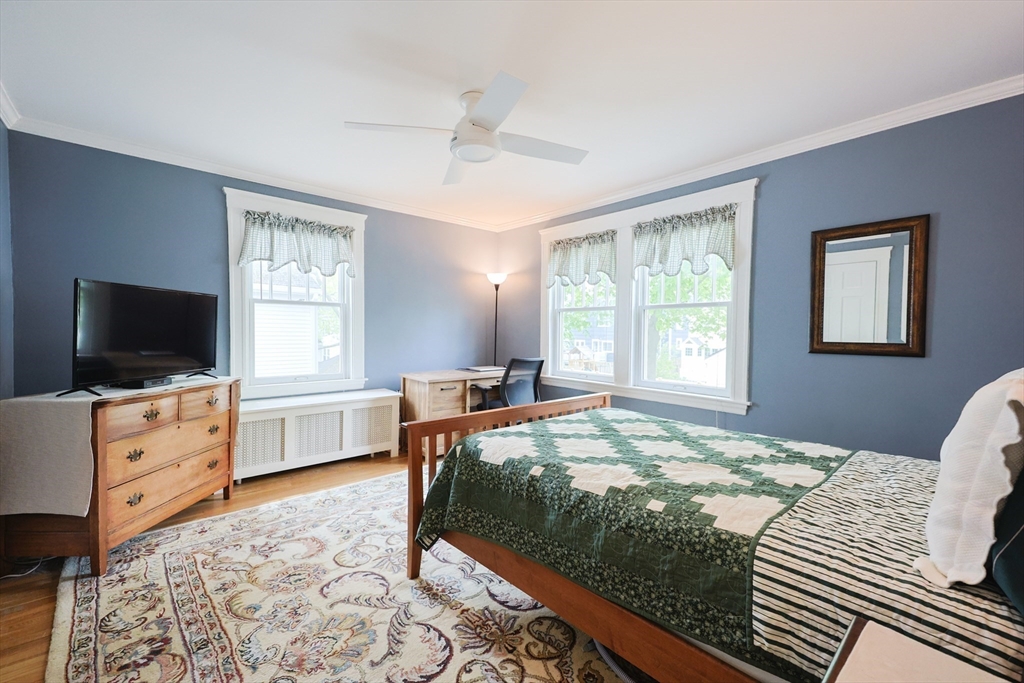 14 Merrill Road Marblehead, MA 01945 - Photo 12 of 29 a bedroom with a bed and a flat screen tv
