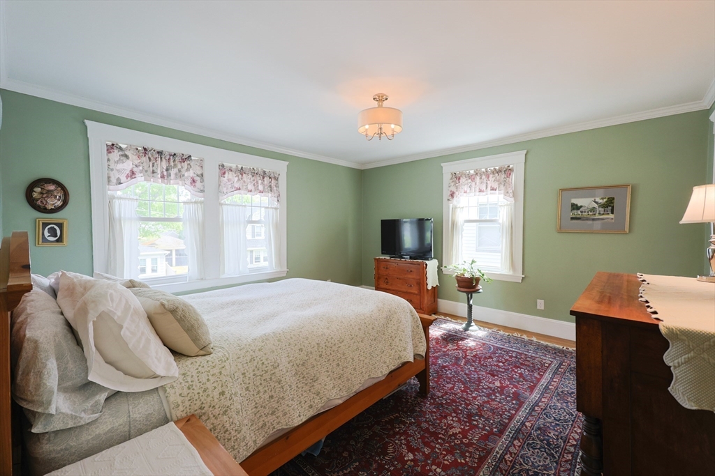 14 Merrill Road Marblehead, MA 01945 - Photo 15 of 29 a bedroom with a bed and a window