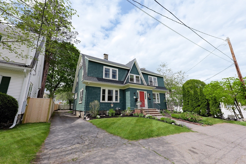 14 Merrill Road Marblehead, MA 01945 - Photo 2 of 29 a front view of a house with a garden and trees