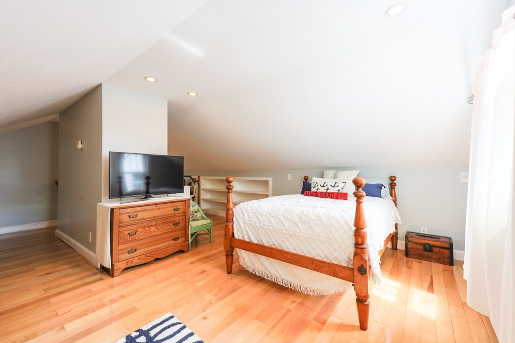 14 Merrill Road Marblehead, MA 01945 - Photo 21 of 29 a bedroom with a bed and flat screen tv