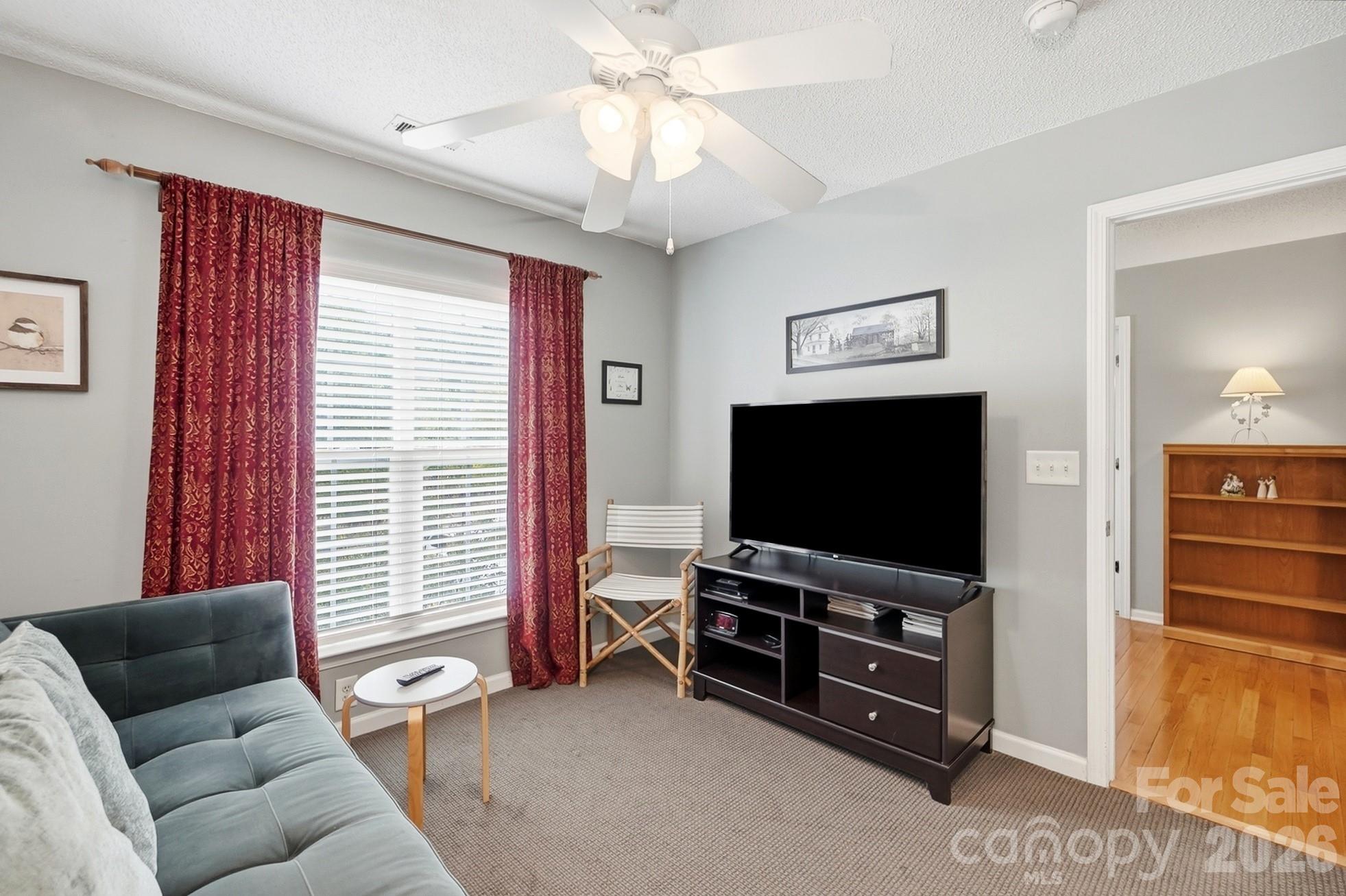 442 Sugar Maple Drive Tega Cay, SC 29708 - Photo 28 of 48 a living room with furniture and a flat screen tv