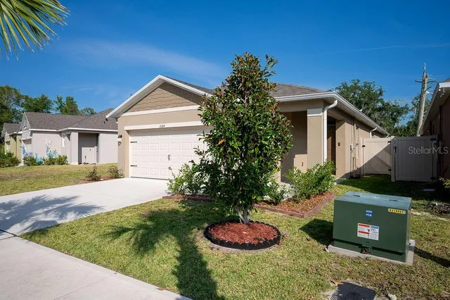 a backyard of a house with lots of green space