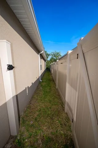 a view of a backyard with pathway