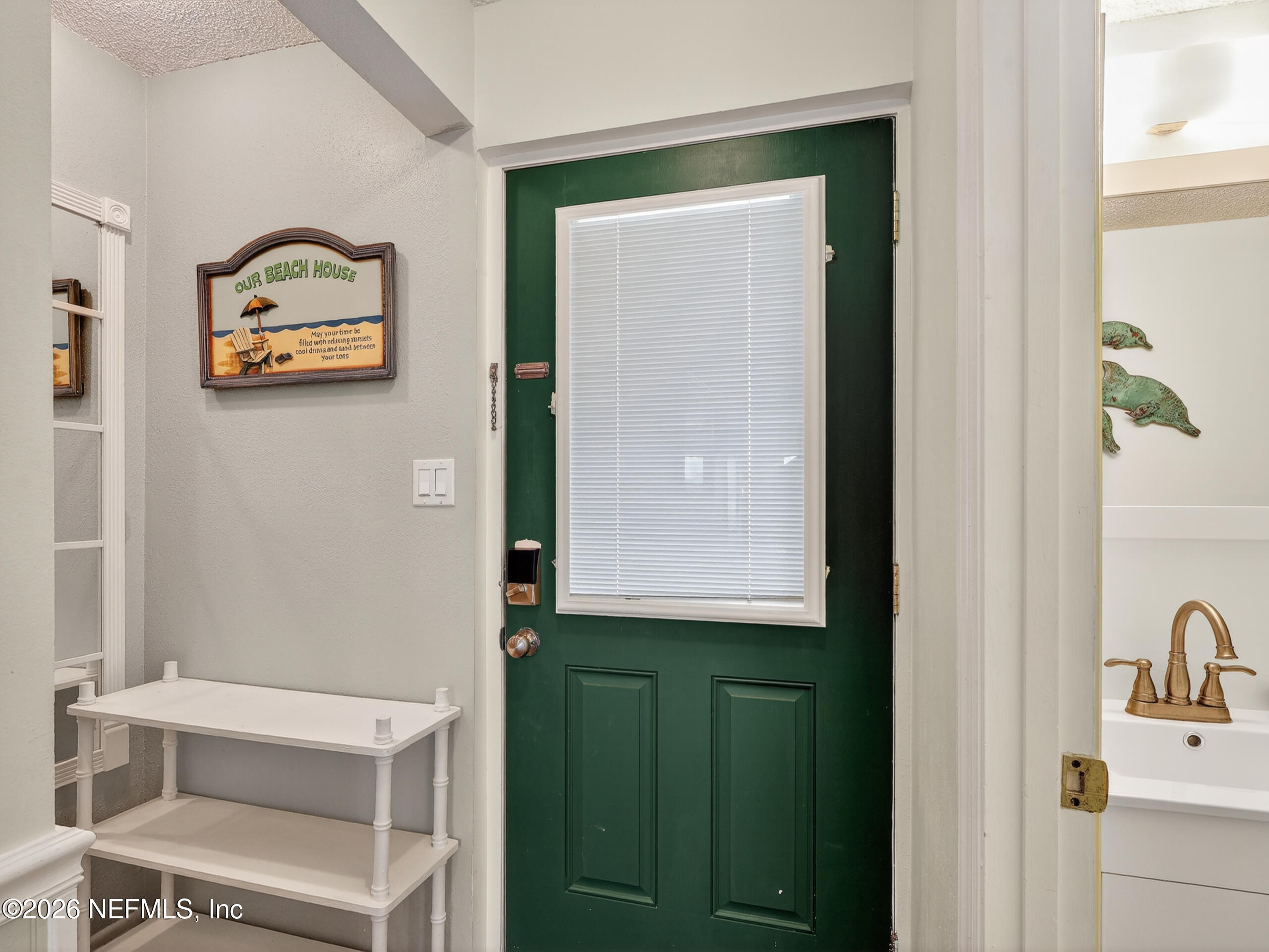 1 Ocean Trace Road, Unit 230 St. Augustine Beach, FL 32080 - Photo 18 of 50 a view of a hallway with front door