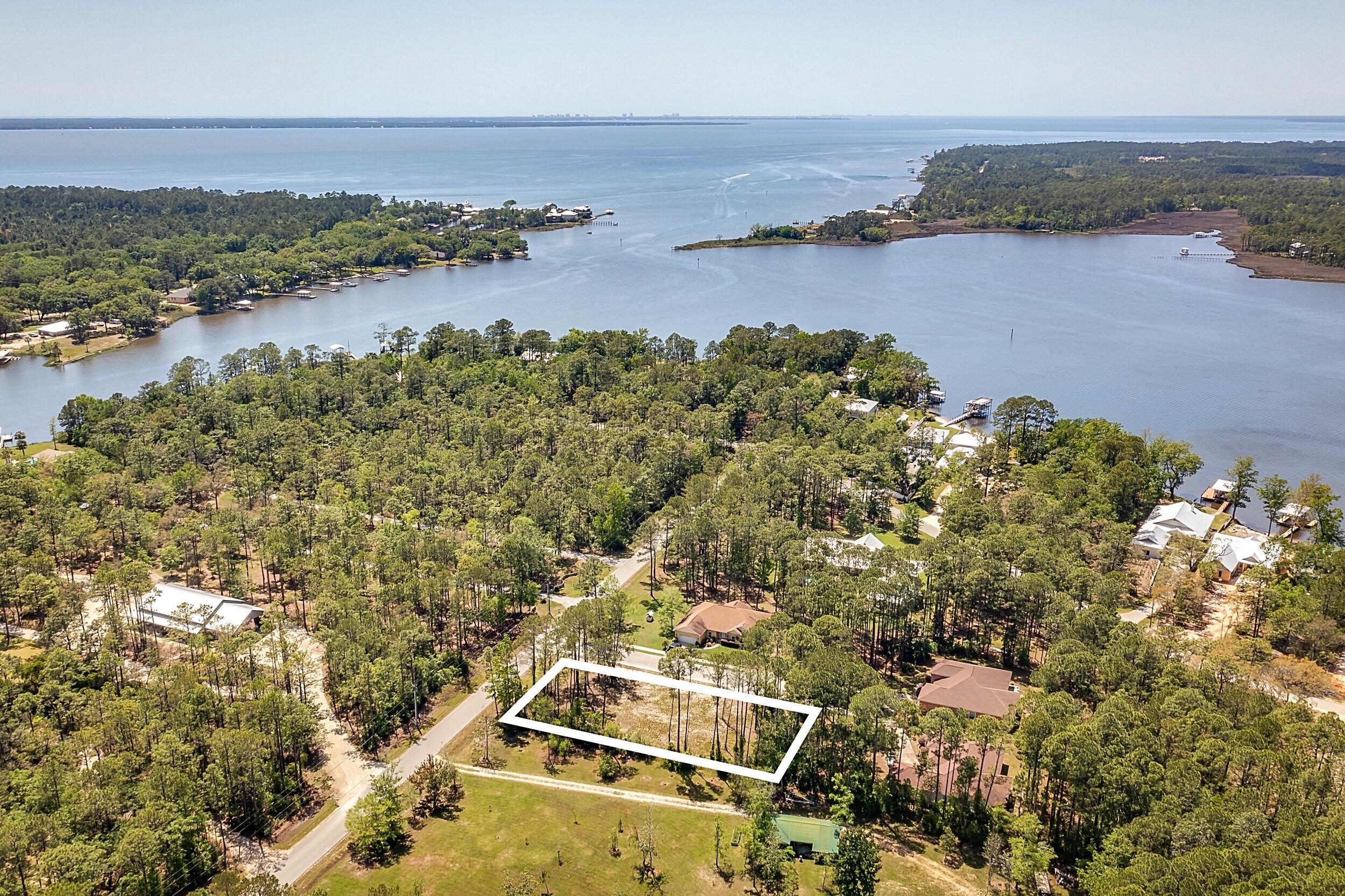 Lot 2 Capri Court Freeport, FL 32439 - Photo 5 of 8 an aerial view of a house with a lake view