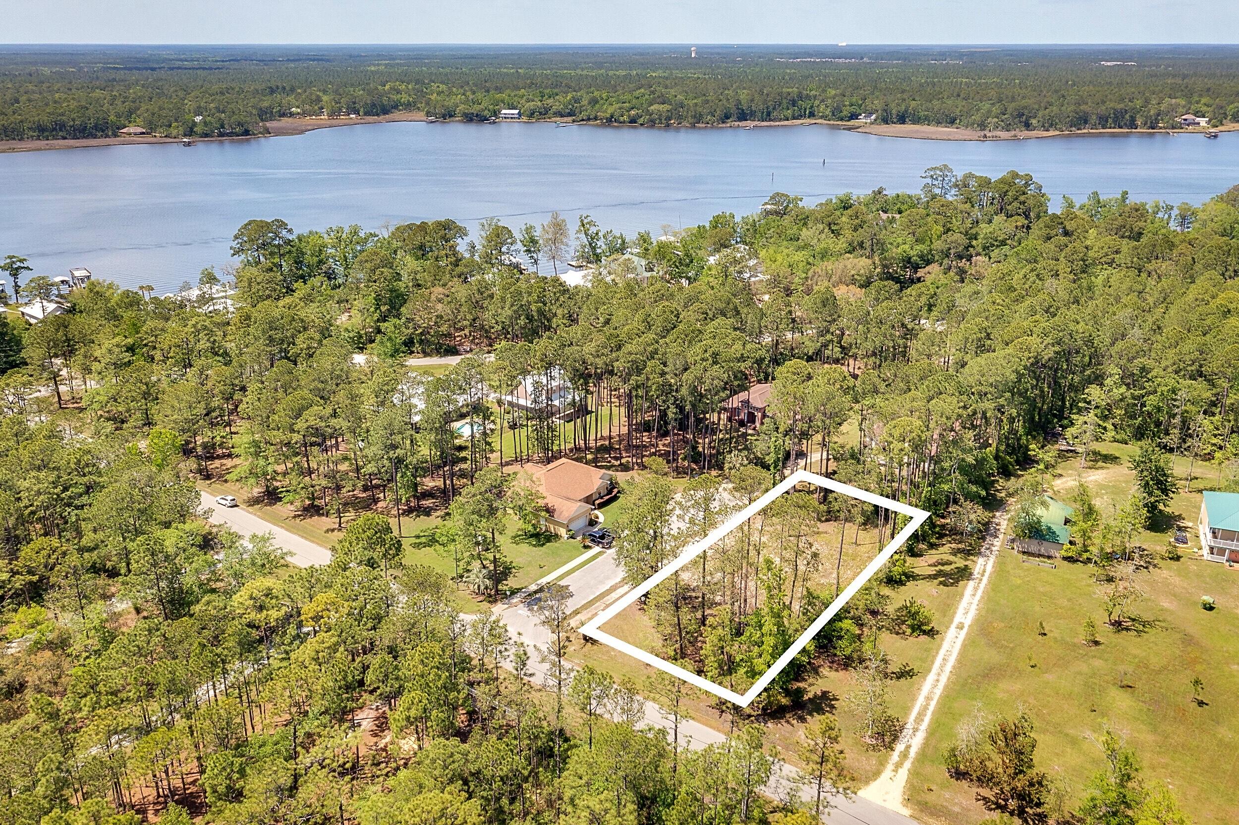 Lot 2 Capri Court Freeport, FL 32439 - Photo 6 of 8 an aerial view of a residential houses with outdoor space and trees