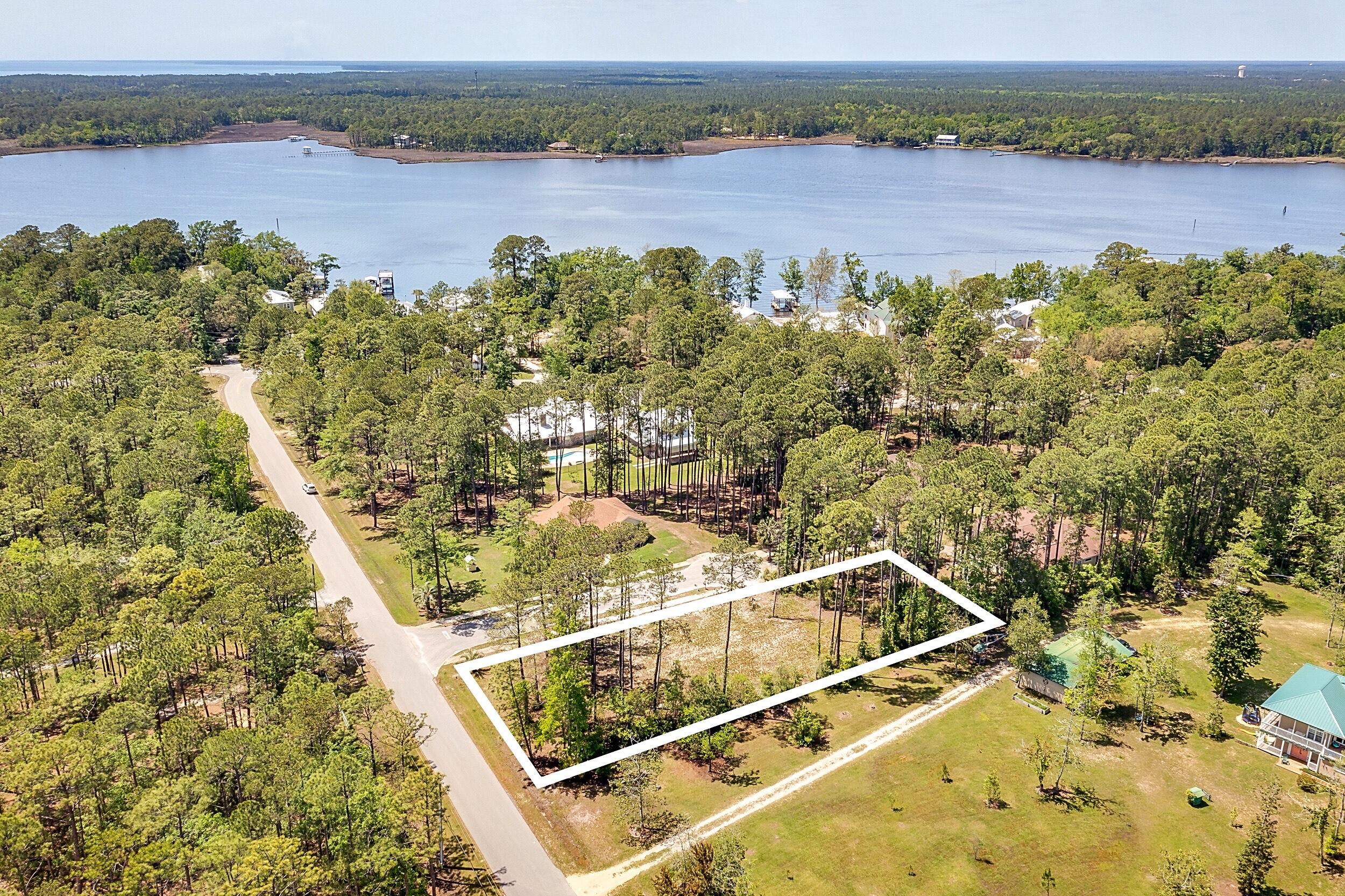 Lot 2 Capri Court Freeport, FL 32439 - Photo 7 of 8 a view of a lake with a mountain view