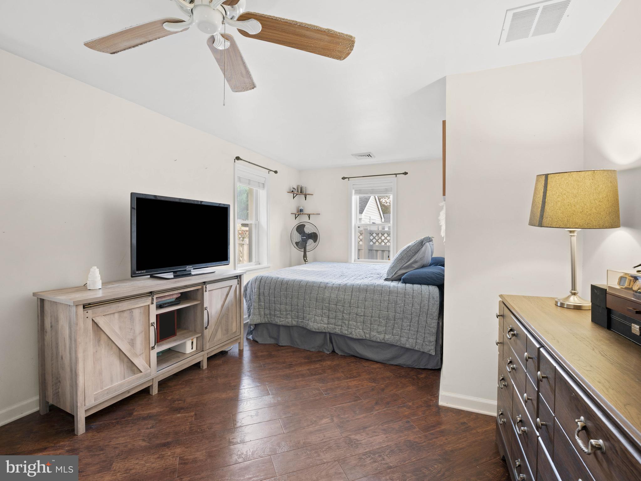303 Garden Terrace Somers Point, NJ 08244 - Photo 12 of 38 a bedroom with furniture and a flat screen tv