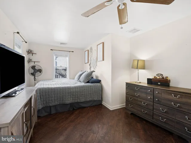 a bedroom with a bed and flat screen tv