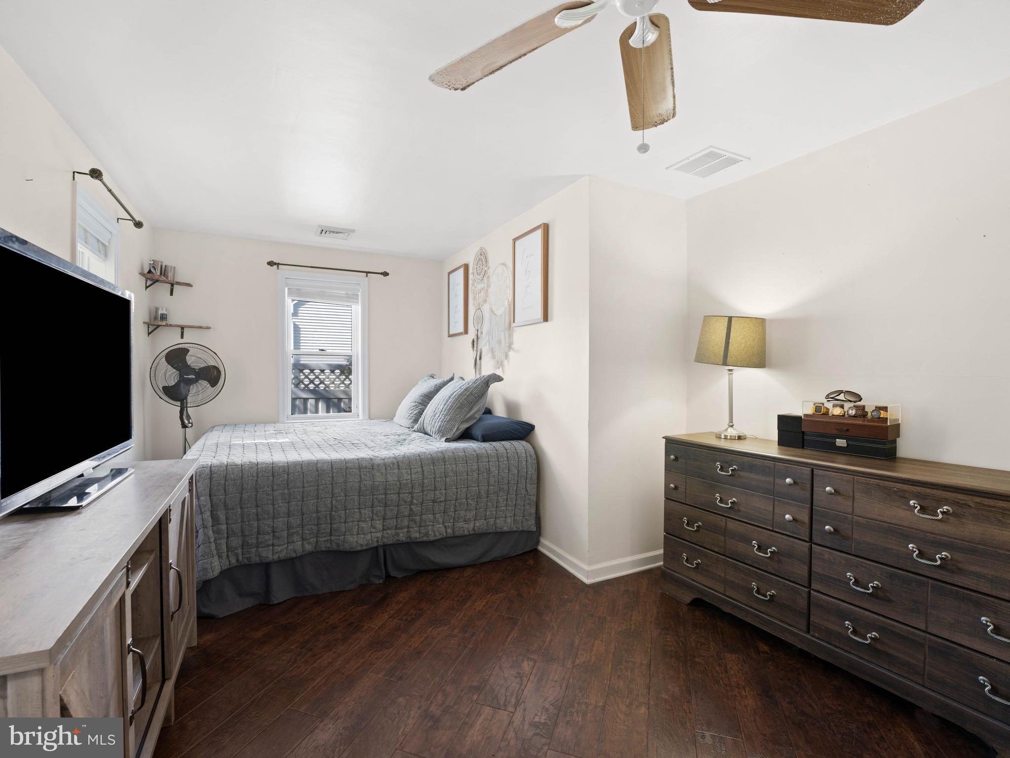 303 Garden Terrace Somers Point, NJ 08244 - Photo 13 of 38 a bedroom with a bed and flat screen tv