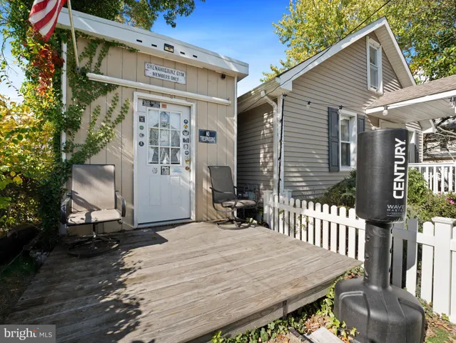 a view of a wooden house with large windows