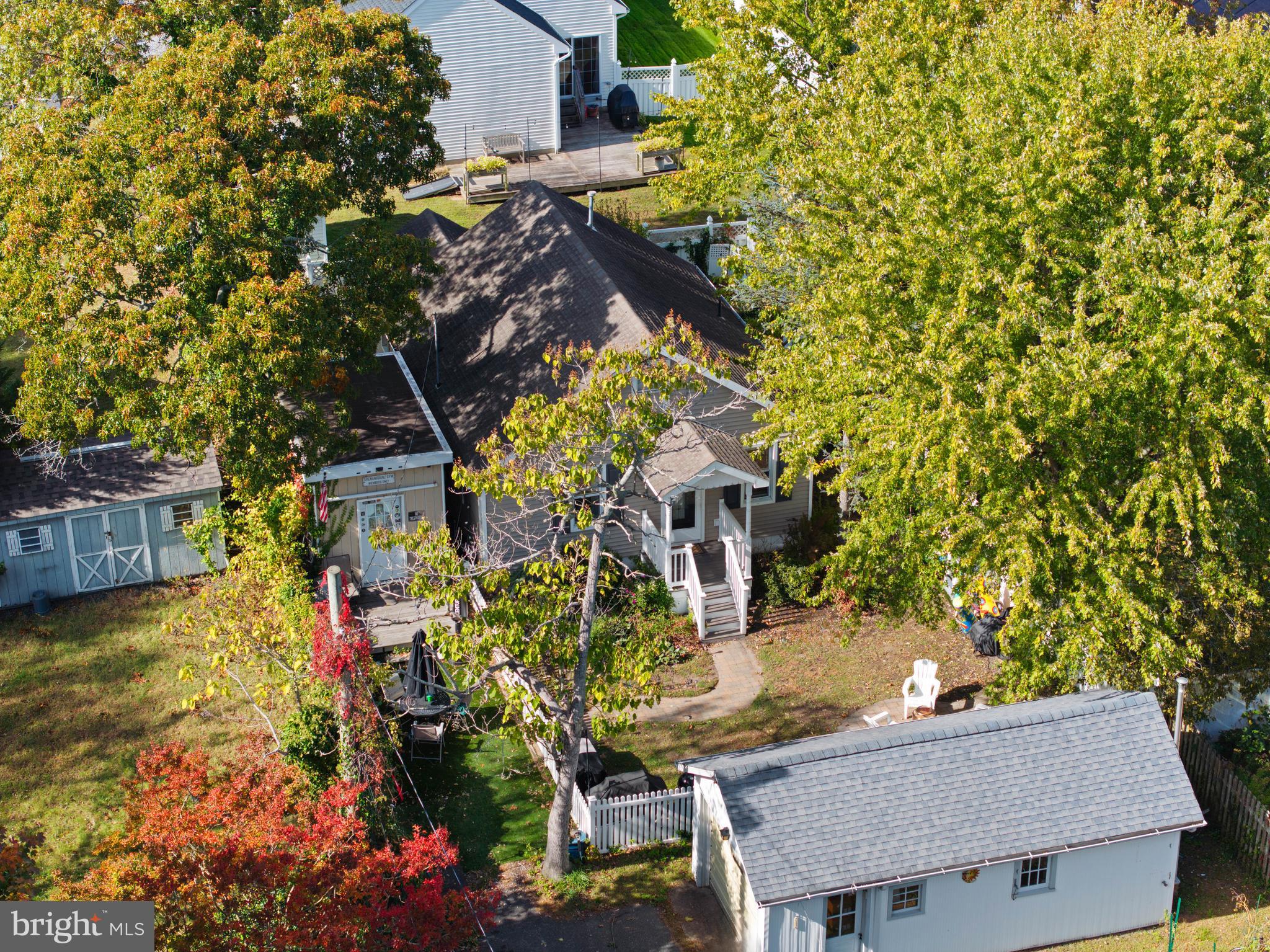 303 Garden Terrace Somers Point, NJ 08244 - Photo 28 of 38 a backyard of a house with table and chairs and potted plants