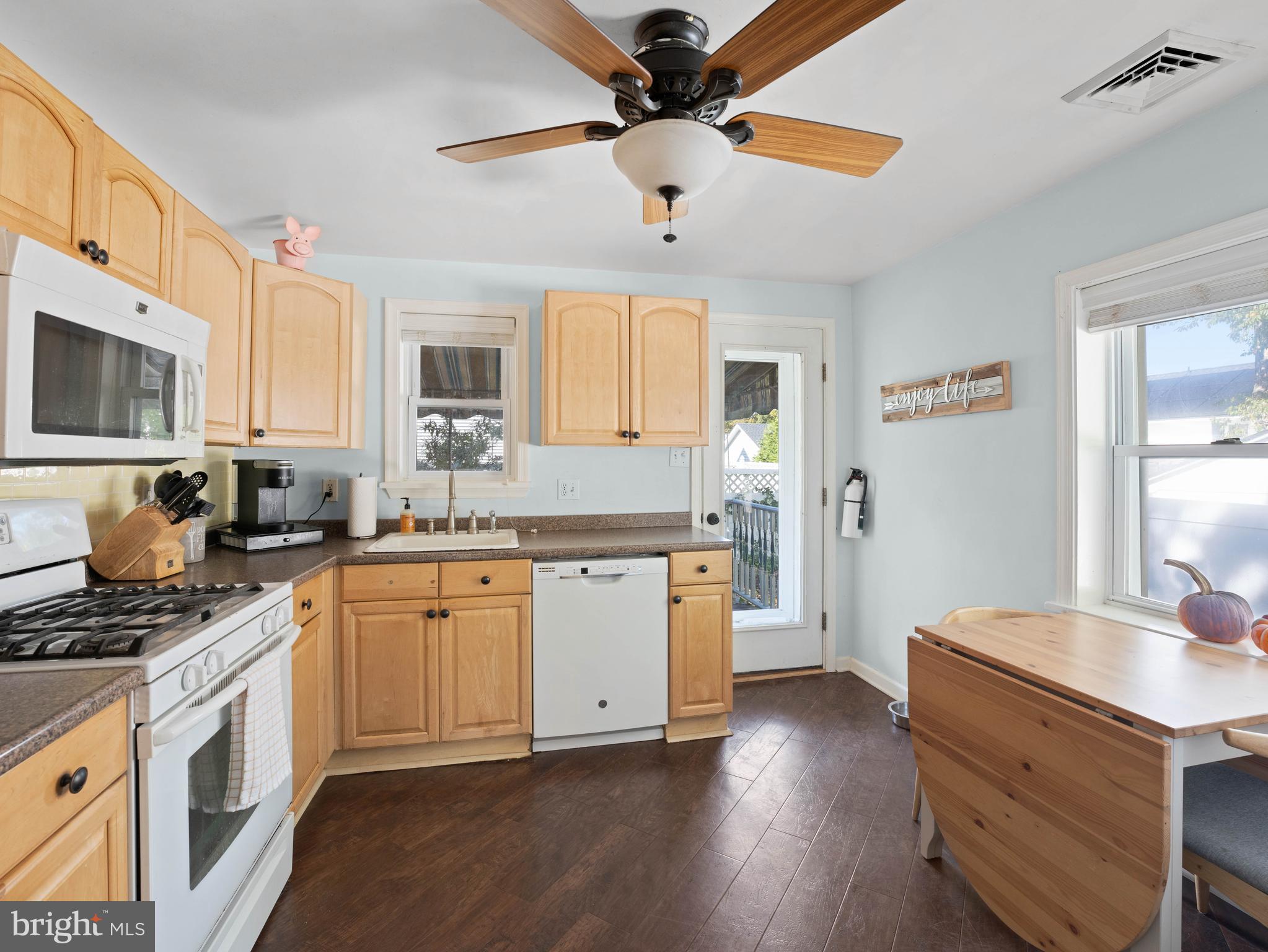 303 Garden Terrace Somers Point, NJ 08244 - Photo 8 of 38 a kitchen with granite countertop a sink cabinets stainless steel appliances and a window