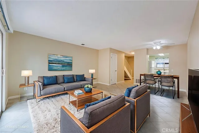 a living room with furniture a table and a lamp