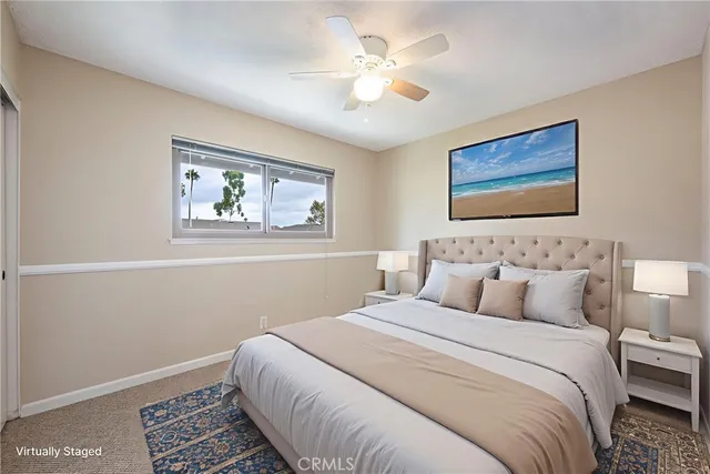 a bedroom with bed and window