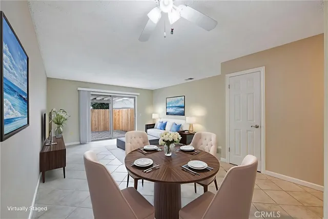 a view of a dining room with furniture and window