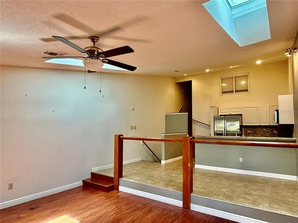 a view of a living room and kitchen