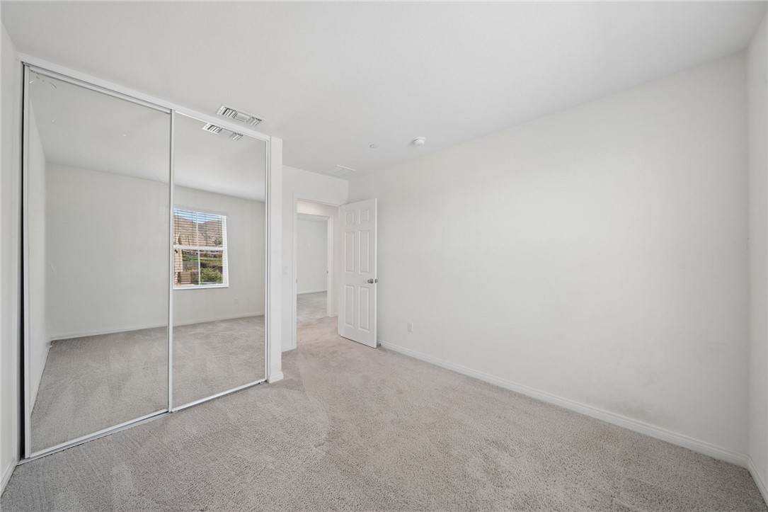 20130 Curaco Court Riverside, CA 92507 - Photo 32 of 43 Secondary bedroom with mirrored closet doors.
