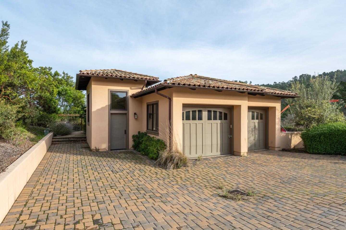 7548 Monterra Ranch Road Monterey, CA 93940 - Photo 5 of 20 a front view of a house with a garden