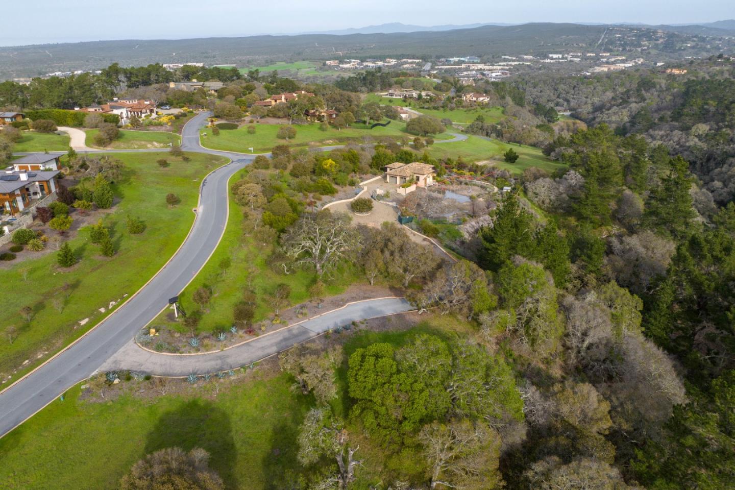7548 Monterra Ranch Road Monterey, CA 93940 - Photo 9 of 20 an aerial view of residential houses with outdoor space and trees