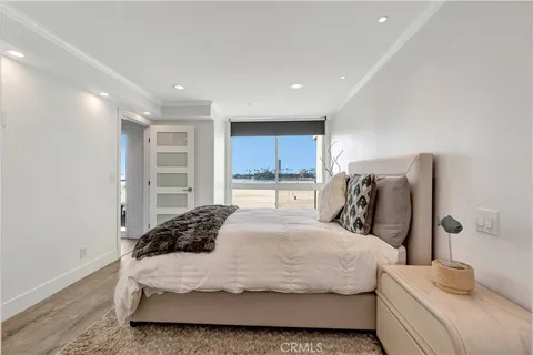 a bedroom with a large bed and a closet
