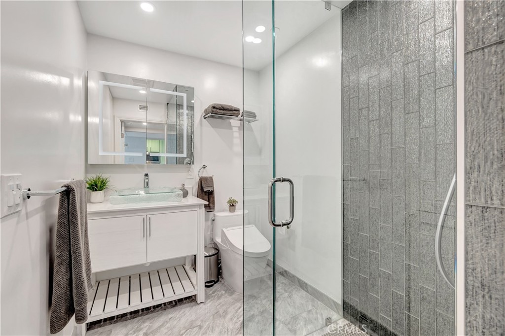 1 3rd Place, Unit 302 Long Beach, CA 90802 - Photo 25 of 51 a bathroom with a sink a toilet and shower