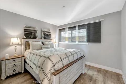 a bedroom with a large bed and a tv