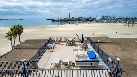 a view of a brick house with large windows