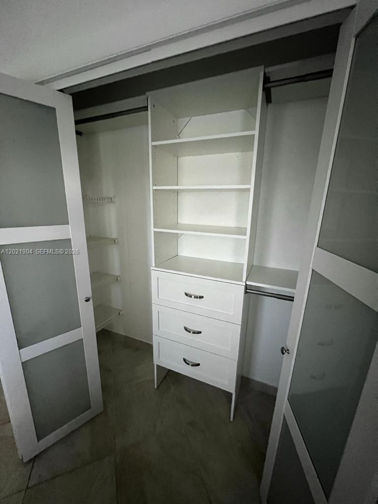 3324 Lakeview Boulevard Delray Beach, FL 33445 - Photo 24 of 36 a view of walk in closet