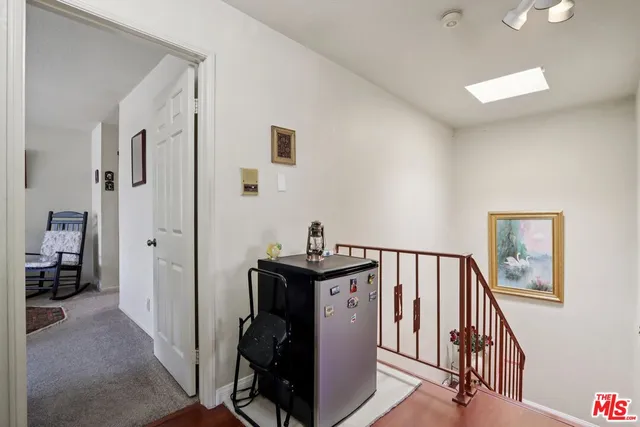 a view of a hallway with workspace and entryway