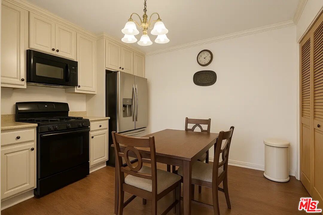 21620 Burbank Boulevard, Unit 9 Woodland Hills, CA 91367 - Photo 4 of 14 a view of a dining room with furniture and wooden floor