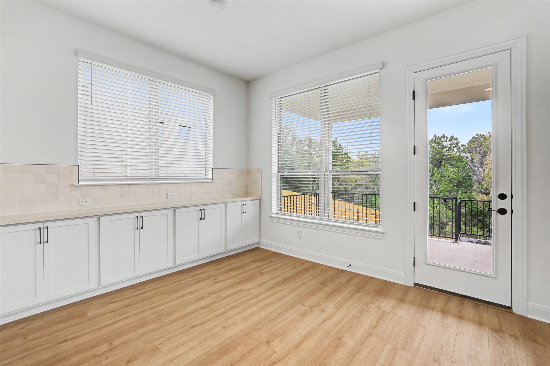 104 Rocky River Road Georgetown, TX 78628 - Photo 14 of 39 a view of an empty room with wooden floor and a window